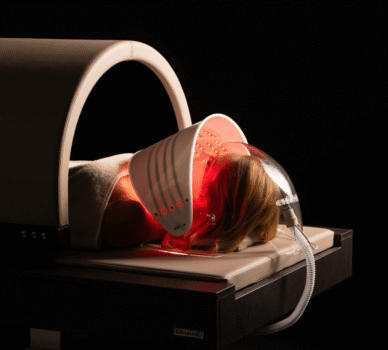 Luxurious spa treatment with red light therapy in serene hotel wellness centre.